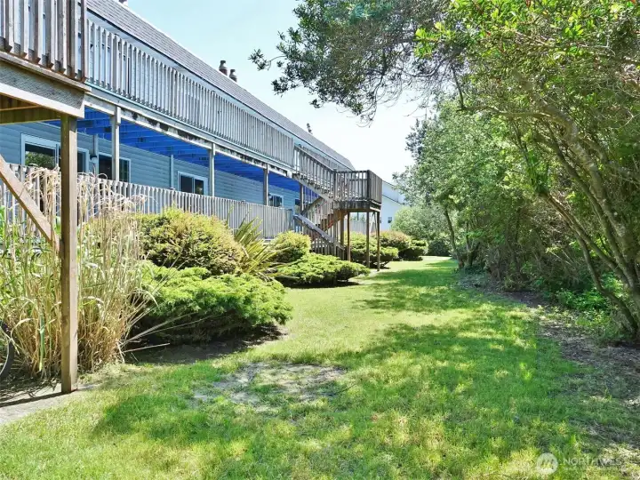 Ocean Surf building's privately situated backyard with mature landscaping.