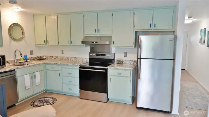 Lovely Kitchen w/ SS appliances, new granite counters, and stripped and repainted cabinets to make them look brand new.