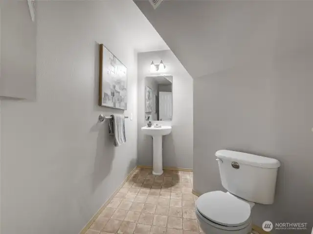 Just off the entry is the convenient powder room.
