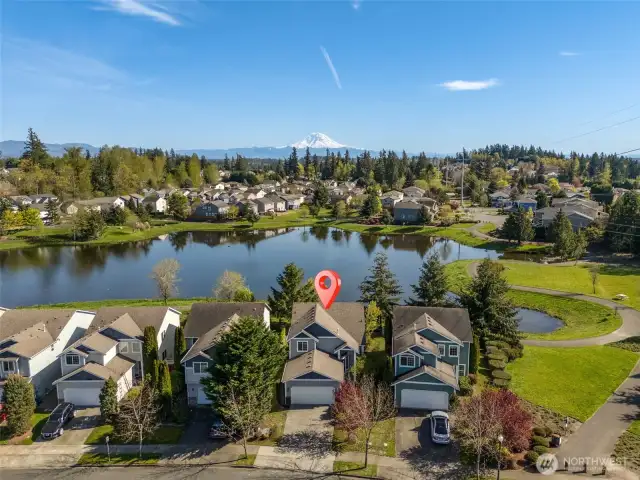 This photo shows which house and still shows the neighborhood lake, and the start of the walking path to the right of this photo.