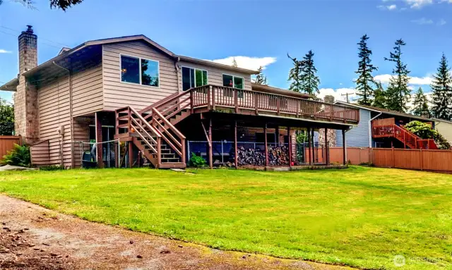 Back of home overlooking large back yard.