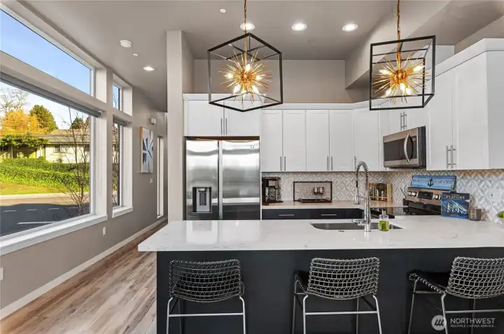 Main level and the corner unit has spectacular lighting through walls of windows.