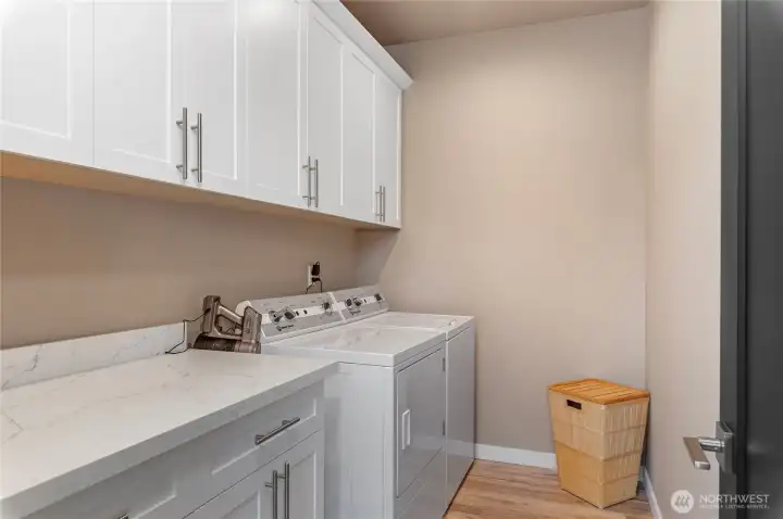Large laundry room located in the lower level between two additional bedrooms.