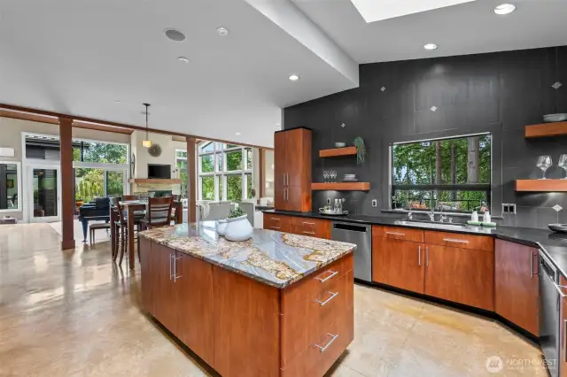 Designed for connection and effortless entertaining, this kitchen is the hub of the home, merging stylish function with forest views and dramatic architectural lines.