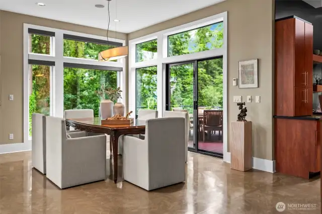 Dine in the treetops. Classic elegance and modern lines with a panoramic backdrop and direct access to the outdoor living experience.