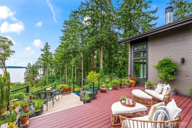 The main deck is an extension of the home’s thoughtful design—offering a garden-level perch above Puget Sound, surrounded by pines, blooms, and birdsong.