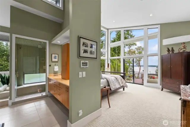 The main level primary suite is stunning.  The layout offers ideal flow between the sleeping quarters, spa bath, and outdoor spaces—elevating daily routines to resort living.