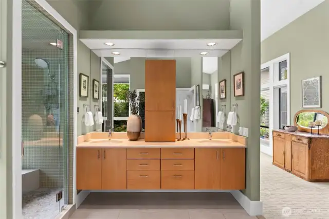 This 5 star spa worthy bath is both elegant and calming, offering warm floors, dual vanities, natural light, and private garden views.