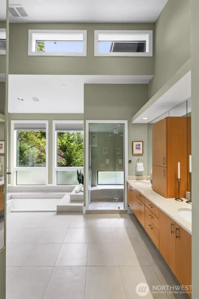 Architecturally significant and utterly serene, this exceptional bath is a rare find—designed with soaring ceilings, clerestory and picture windows for natural light and privacy.  A true retreat that fuses form, function, and tranquility.