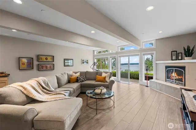 The lower level offers exceptional versatility.  Perfect for extended stay guests, in addition to this spacious family room featuring a gas fireplace, wetbar and direct access to a private patio, it features a bedroom suite with sliding doors to the patio and these amazing views, as well as a bonus/flex room perfect for a gym or additional sleeping space.