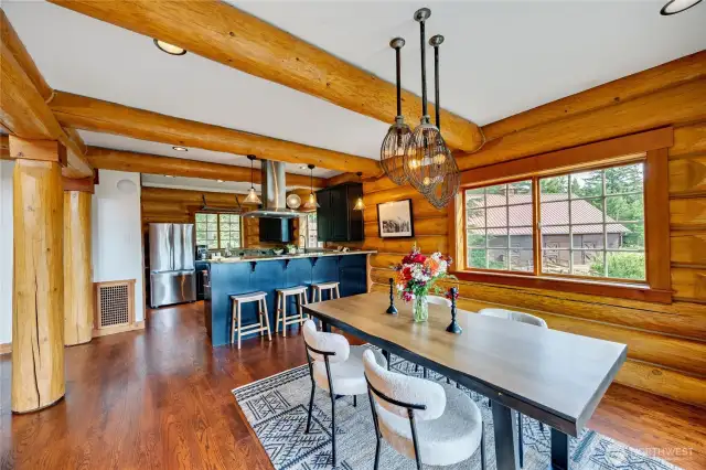 kitchen with seating bar opens to dining room.