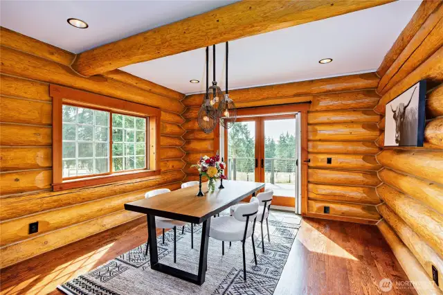Cozy dining room with French doors to deck.
