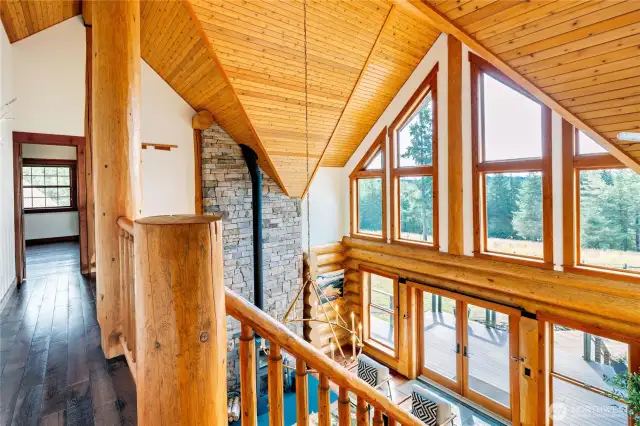 Gallery walk with sweeping views leads to Primary Ensuite & Office.