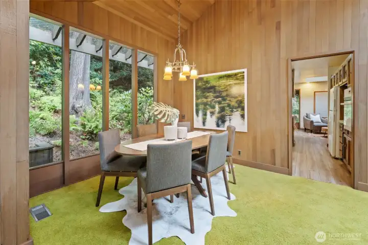 Gather in style—Elegant dining room with vaulted ceilings and warm finishes, designed for both intimate meals and lively gatherings.
