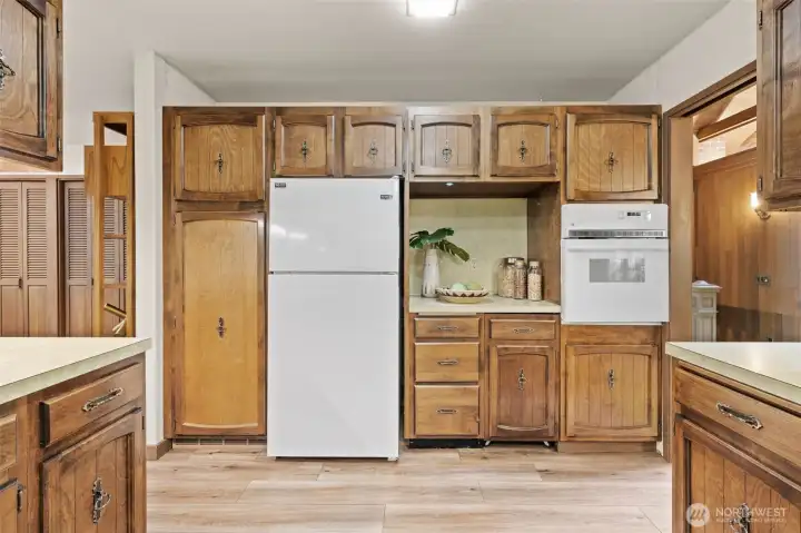 Built-in appliances and expansive storage create a highly functional kitchen with endless potential for elevated living and entertaining—make sure to look for the hidden built-in cutting board.