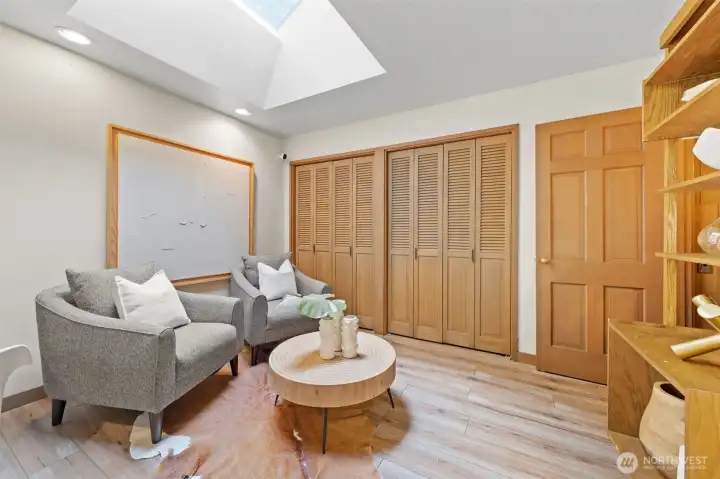 In this versatile space just off the kitchen, where a skylight fills the room with natural light and generous storage keeps everything neatly tucked away.