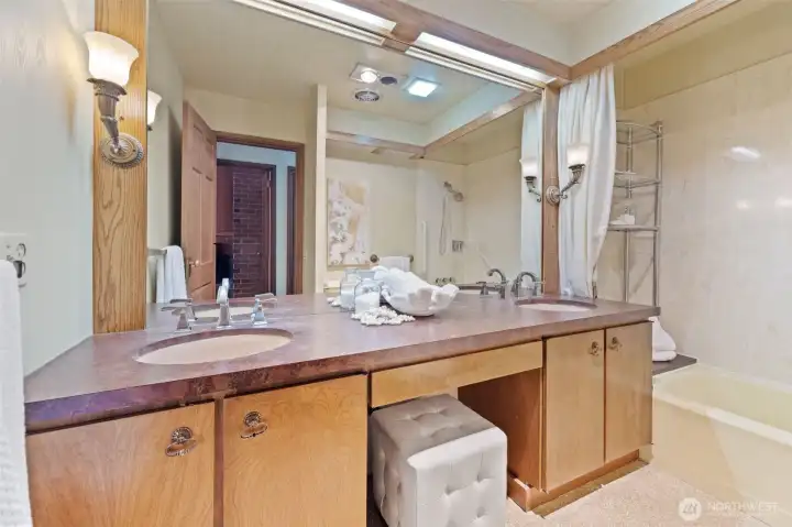 Spacious Lower Level full bathroom featuring dual sinks, a vanity area, and a shower/tub combo—perfect for everyday convenience.