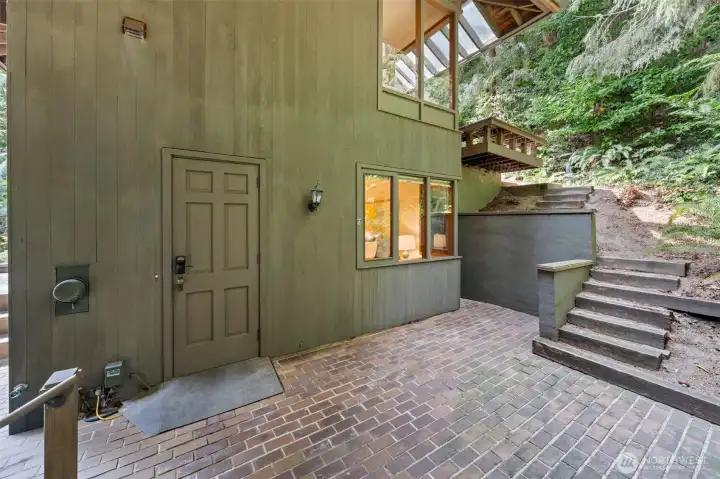 Private side entry offers convenient access to the lower level, blending functionality with ease for everyday living or guest use.