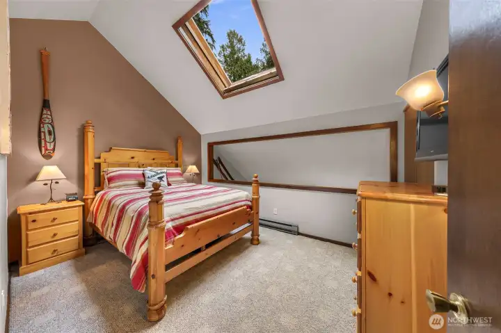 Primary Bedroom with oversized skylight