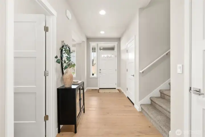Welcome home! Open and inviting entry way. The front door with transom window above, allowing natural light to stream in and brighten the space. Welcome home! Open and inviting entry way. The front door with transom window above, allowing natural light to stream in and brighten the space.