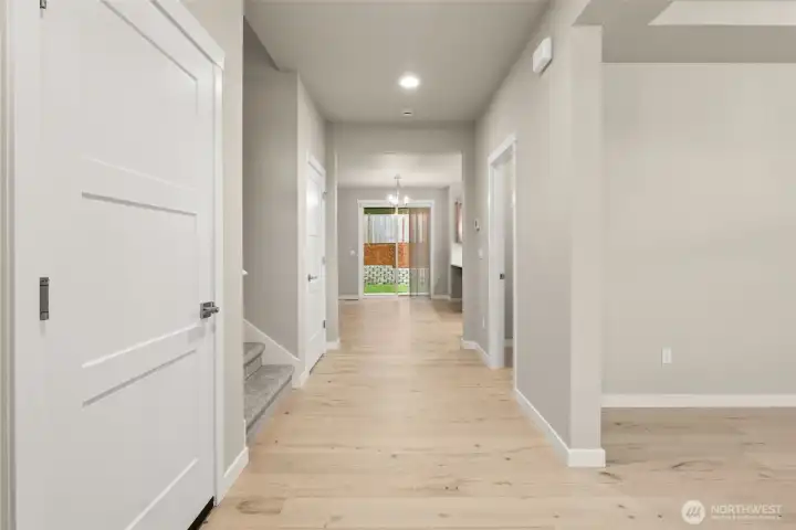 Hardwood flooring included in entry, kitchen, dining and nook area adding warmth and continuity throughout the hallway.