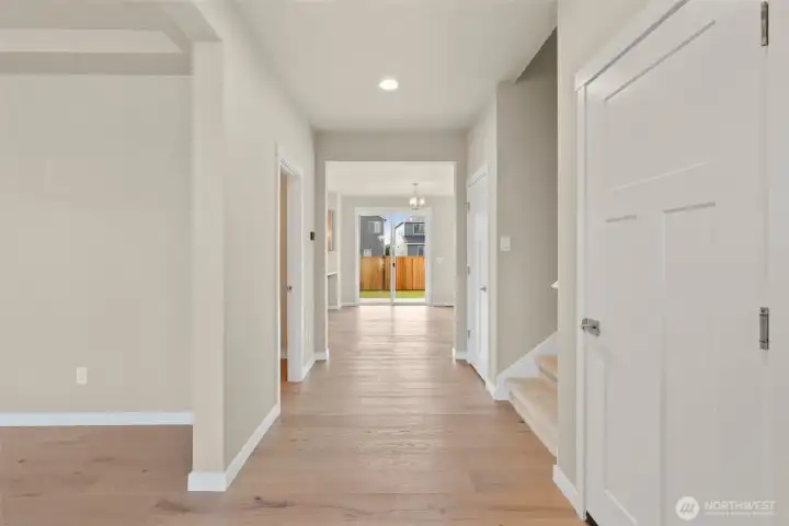 Hardwood flooring included in entry, kitchen, dining and nook area adding warmth and continuity throughout the hallway.