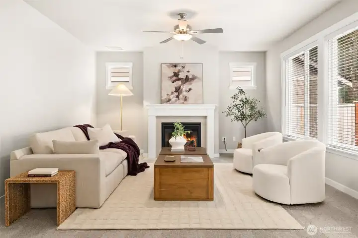 Spacious and inviting great room with a clean, modern design and gas fireplace including a ceiling fan. Spacious and inviting great room with a clean, modern design and gas fireplace including a ceiling fan.