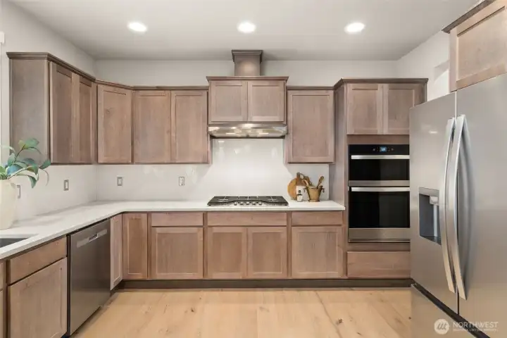 Kitchen- appliances include microwave/oven combo, gas cooktop w/overhead vent hood & dishwasher plus refrigerator! Kitchen- appliances include microwave/oven combo, gas cooktop w/overhead vent hood & dishwasher plus refrigerator!