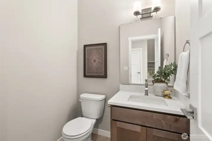Main floor powder/ half bath for guests and convenience. Main floor powder/ half bath for guests and convenience.