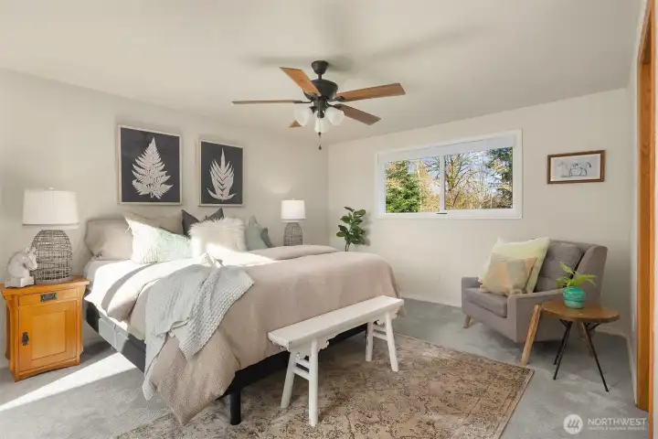 Primary suite with updated bathroom, dual vanities, large walk-in closet and slider door access to outdoor patio area and hot tub