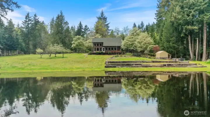 Nearly 250 feet of private, no-bank lake frontage. You have the most amazing setting for relaxing by the waterfront, kayaking, fishing or gardening in your vast garden space.