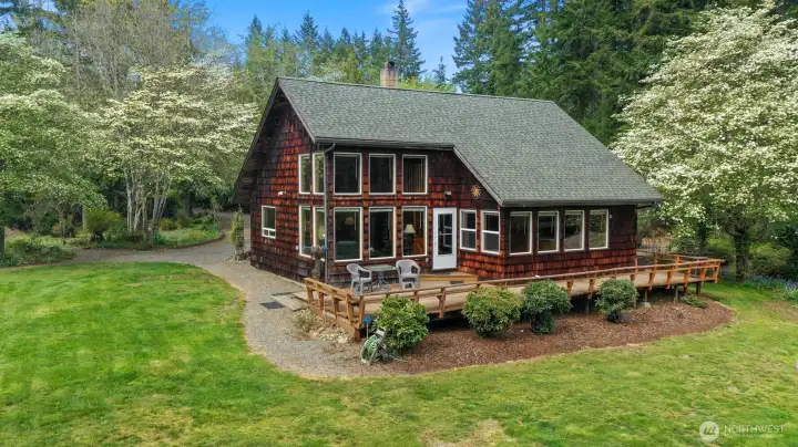 This single-owner home offers pride of ownership throughout, with inviting spaces that flow effortlessly from indoors to a private wraparound deck overlooking the lake.