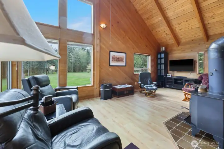 Stay cozy year-round with a wood stove, complete with an ample supply of firewood included with the sale.