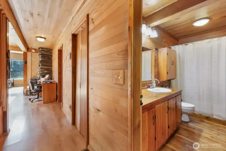 Hallway leading in from side door (adjacent to shop), to the right is the main level full bath.