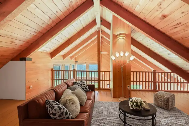 Alternate view of loft space. Loft overlooks the main living area. Virtually staged to showcase possibilities.