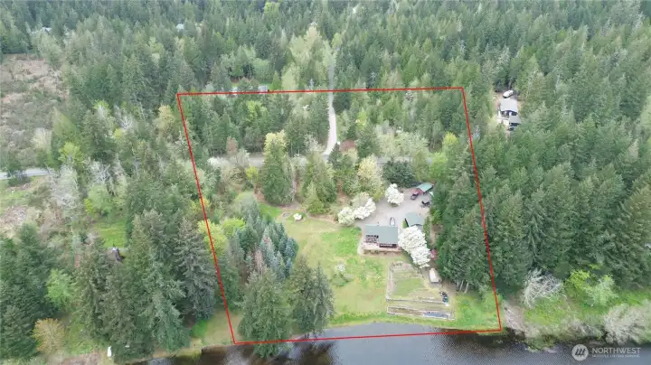 Lot lines are approximate. Over 5.5 acres to enjoy—plus extra acreage across the street with shop potential.