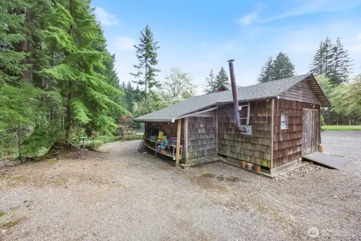 Approximately 16x24 Shop with wood stove plus 2 additional side rooms, one was utilized as a cold storage.