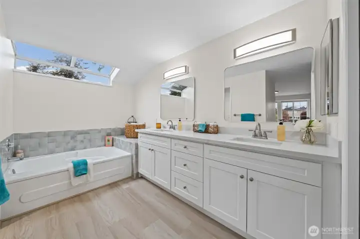Primary bath updated & stunning! Double sinks, new laminate flooring.