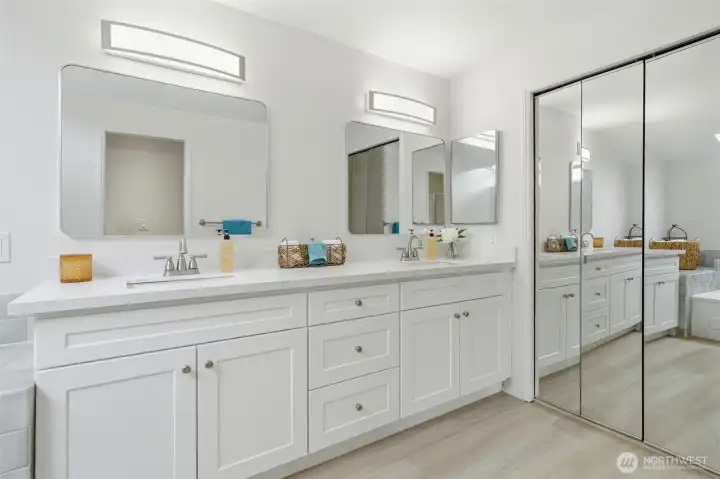 Primary bath updated & stunning! Double sinks, new laminate flooring.