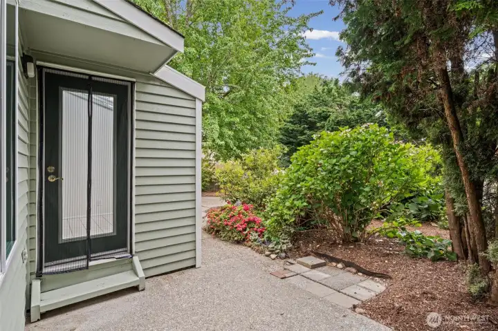 Door off kitchen/dining area leads to back yard.