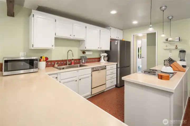 Fun tile backsplash matches the floor and warms up the space.