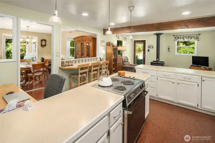 This kitchen is truly the heart of the home with access to dining area, eating bar, sitting area and even space for a desk. Many goodies have been baked in this kitchen -- it is a great space to cook in.