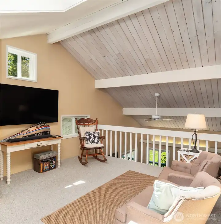 Loft area above the living area is a great "getaway" space for quiet activities; games, school work, reading or even movies.