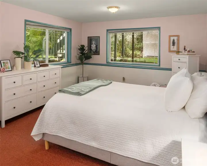 On the ground level, the bedroom looks out to the north and west.