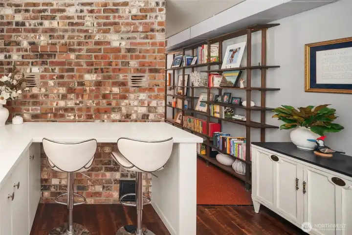 Fun exposed brick chimney wall on the ground level adds so much character.