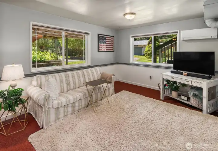 Sitting area on ground level. One of two new Mitsubishi mini splits for year-round comfort and energy efficiency.
