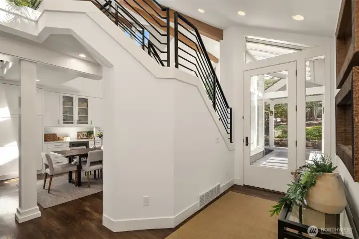 Northwest transitional style with soaring ceilings and walls of windows creates an atmosphere of comfort and ease.