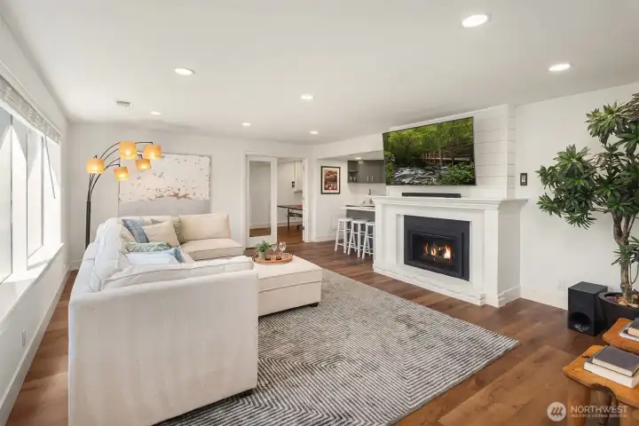 The lower level provides ideal guest or teen quarters alongside exceptional entertaining space, including a bonus room with bar—perfect for game nights or multigenerational living.