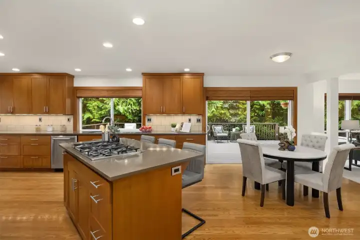The kitchen, nook and family room all overlook the huge composition deck. It's very private and makes indoor/outdoor living a breeze