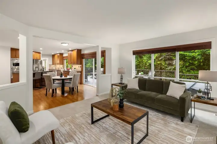 Large family room, overlooking the deck, with large picture window to bring in the light.